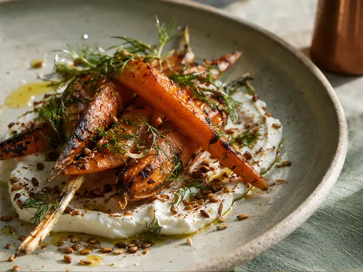 Coal-roasted carrots with labneh and toasted seeds